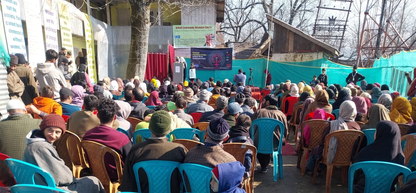 A packed open-air audience at the Anhad Community Resource Centre in Khumriyal